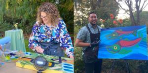 Artists Reeve Washburn (left) and Toka Valu (right) with their paintings created live at the event.