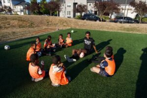 NewHolly soccer players bonding as a team. Photo credit to Intercity Soccer League. 