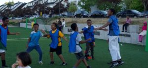 NewHolly youth enjoying soccer practice with friends and family watching. Photo credit to Intercity Soccer League.