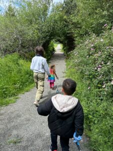 Eco hero kids taking trash pickers to the trails to make sure Longfellow Creek stays clean from trash. They led the way as a group of adults followed their lead picking up many bags of trash.